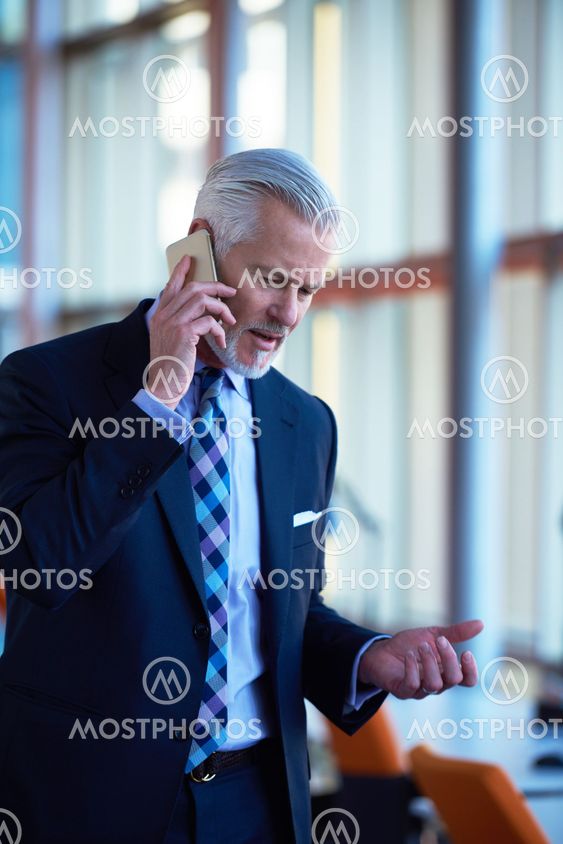 senior business man talk on mobile phone