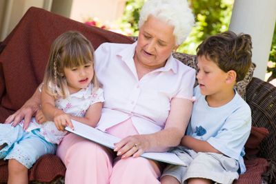 Grandmother reading to grandchildren