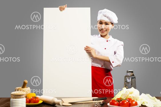 Asian female chef holding blank poster