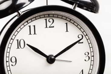 Close up of a black vintage alarm clock