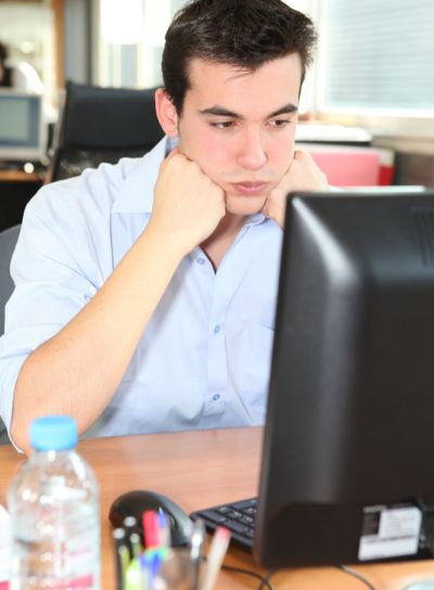 Frustrated student in front of his computer