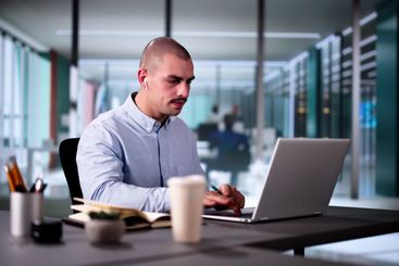 Virtual Learning: Male Student Excelling In Online...