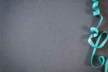 board with a tailor measuring tape