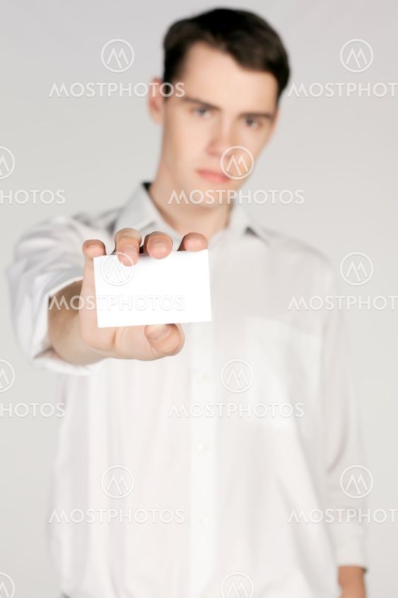 Young man with blank business card