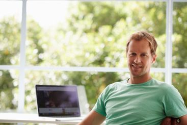 Laptop, break or portrait of happy man in remote work...