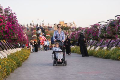 mother and daughter in flower garden