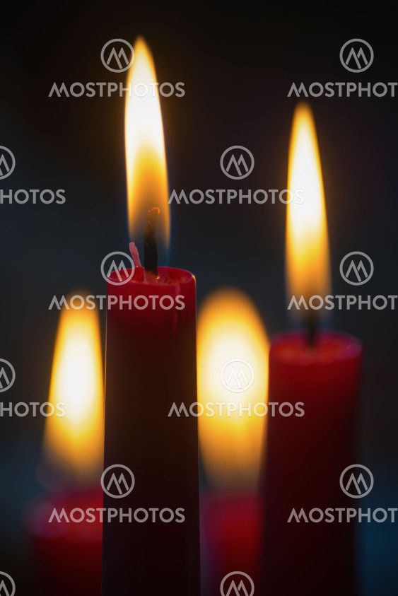 Red candles with dark background