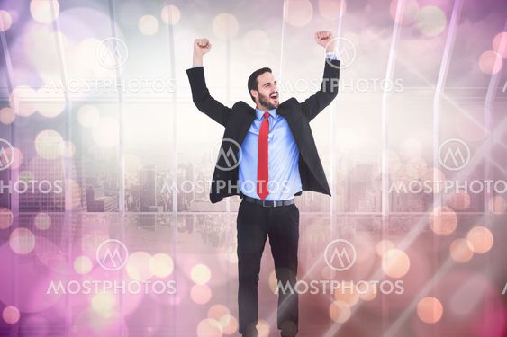 Composite image of happy cheering businessman raising his arms