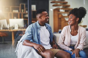 Home, funny and black couple with smile, love and joy...