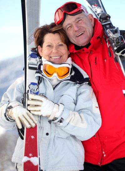 Older couple with skis