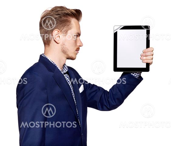 Young man is looking at digital tablet