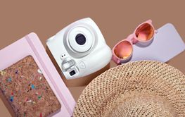 Travel blogger preparing for summer vacation with trendy...