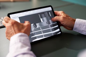 Male Engineer Developing Mechanical Parts Using 3D CAD...