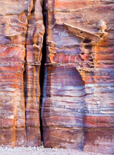 unfinished tomb in multicolour sandrock of Petra