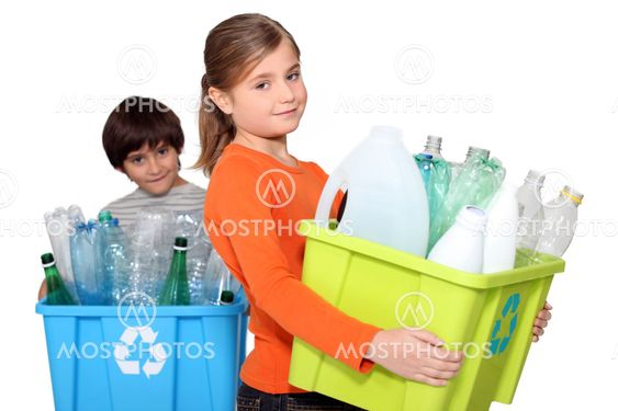 Children recycling plastic bottles