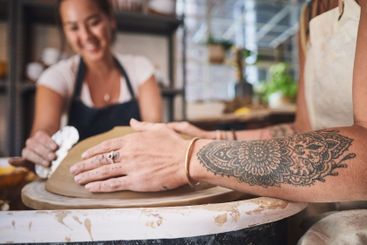 People, hands and pottery class for team, working...