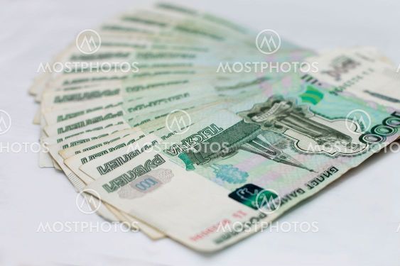 Scattered Russian 1000 rubles banknotes closeup