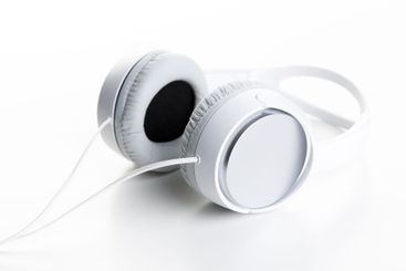 Pair of earphones close up on grey background