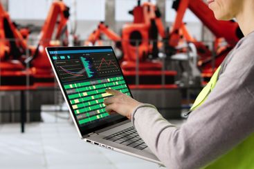 Female Engineer Supervising Production Line