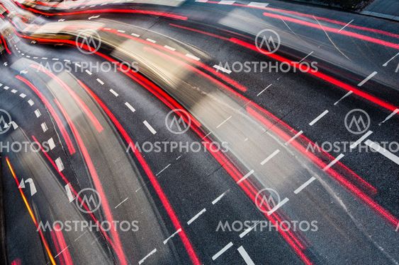 Motion blurred city road traffic (color toned image)