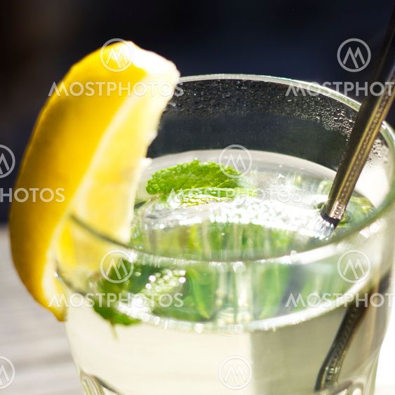 Close up of a glass of tea with a fresh peppermint