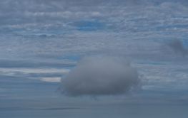 Cloudscape with white clouds in a blue sky.