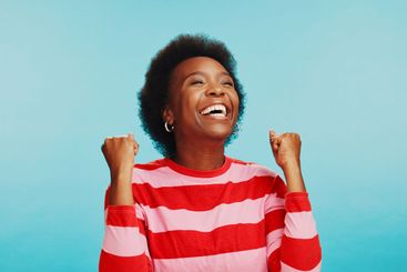 Excited, winner and black woman with celebration in...