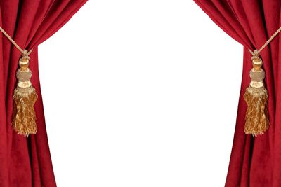 Luxury red curtain with a tassel and rope isolated on white