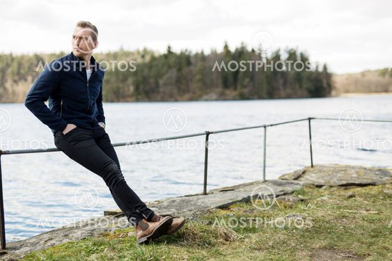 Lonely man sitting down outdoors