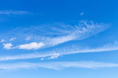 light spindrift and cumulus clouds in blue sky