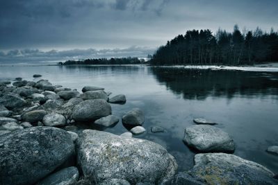 Seacoast in march with stones on the foreground