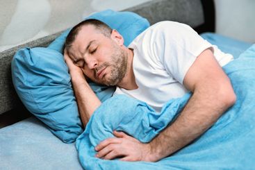 Mature Guy Sleeping In Cozy Bed At Home During Quarantine