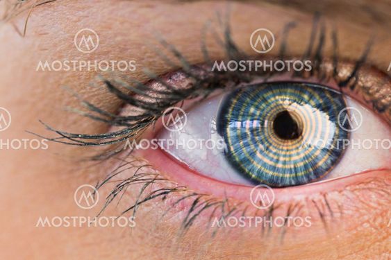 Composite image of close up of female blue eye