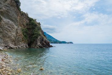 Beautiful rocks and bright turquoise water among layered...