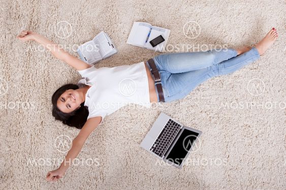 Young woman lying daydreaming