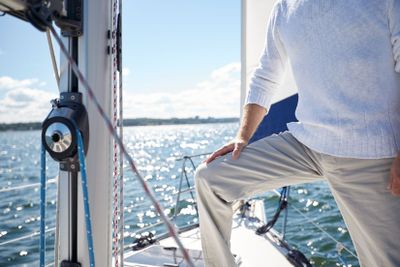 close up of senior man on yacht sailing in sea