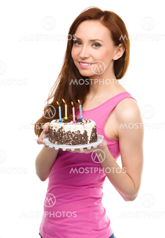 Young woman with anniversary cake