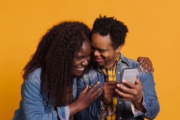 African american young couple having fun together with...