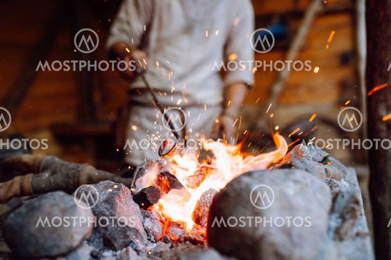 Fire crackling in blacksmith workshop of forging metal....