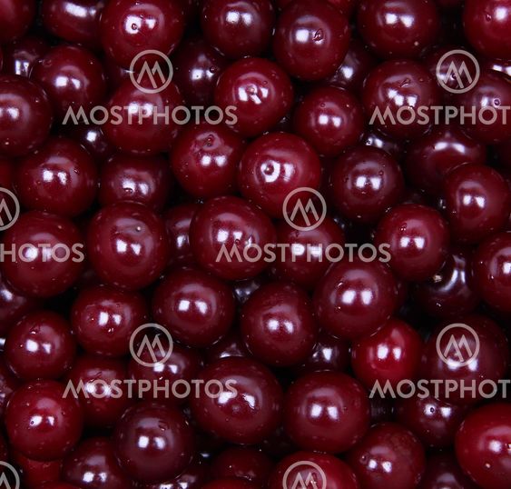 Wet ripe red cherries as background