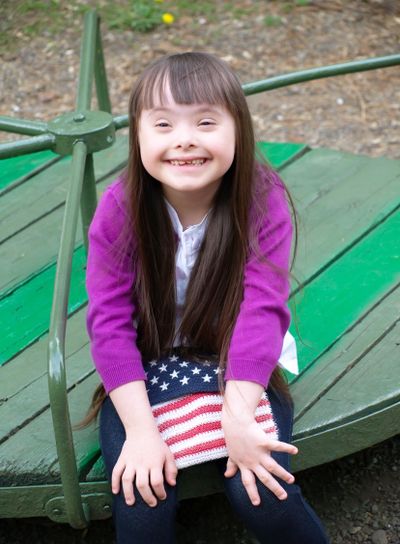 Portrait of beautiful young girl on the playground