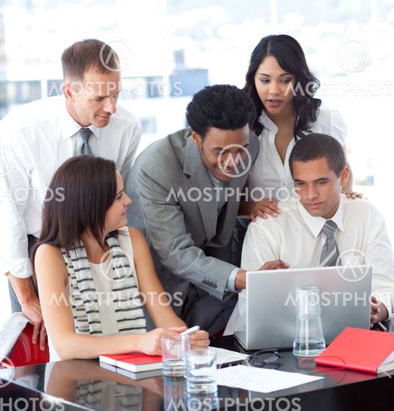 Business people working together with a laptop
