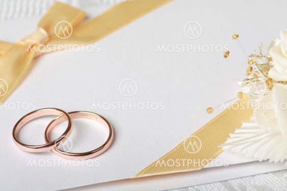 Wedding rings and wedding invitation