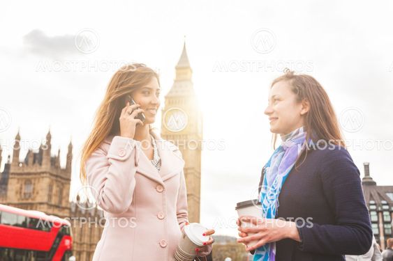 London, two women standing with Big Ben on background