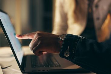 Laptop, screen and business people together at night for...