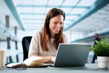 Virtual Business Chat: Female Executive Writing Notes...