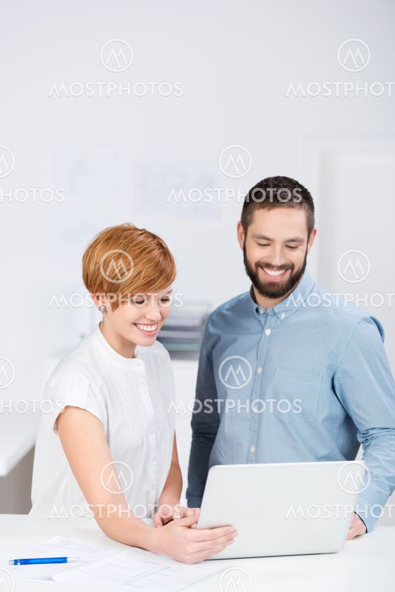 Happy Businesspeople At Meeting