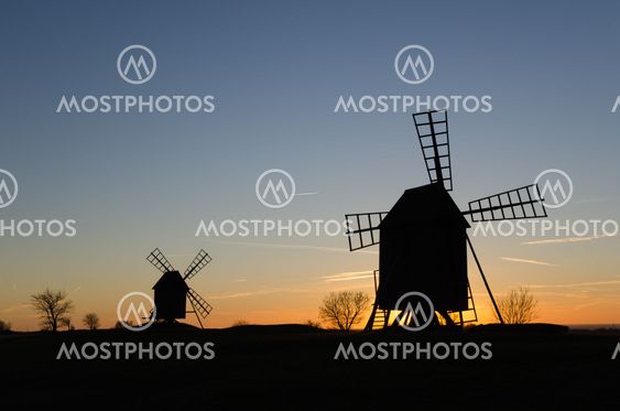 Old windmill silhouettes by twilight