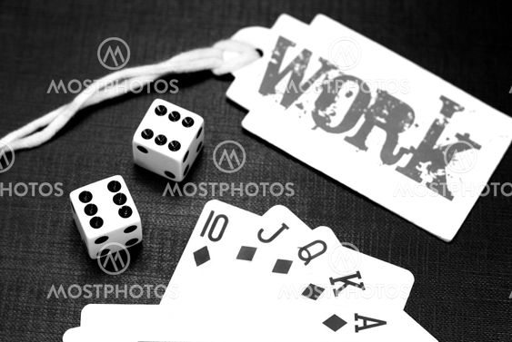Dices and playing cards on a black background