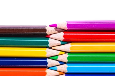 Vibrant colored pencils arranged neatly in a creative...